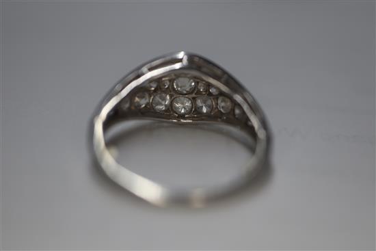 A white metal and diamond cluster set elliptical shaped ring, size H/I.